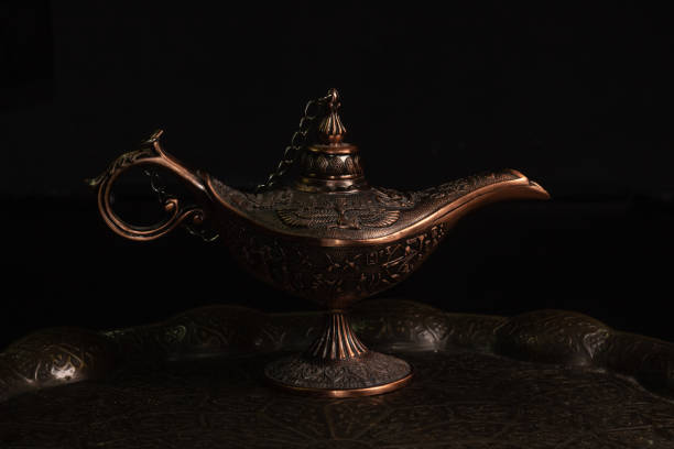 istock Aladdin's magic lamp isolated on black background 1447113573