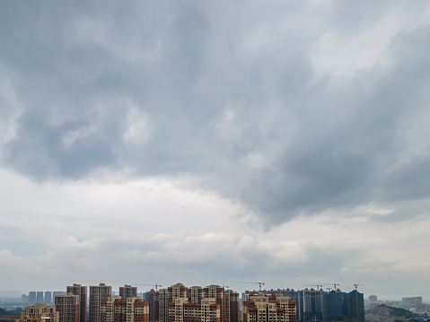 Aerial view of the high-rise building under the dark cloud