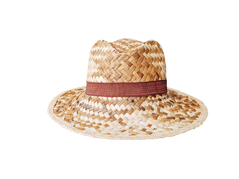 Straw hat isolated in the studio. Concept of fashion accessory and beach vacation.