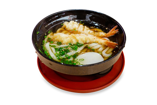 Die cut of Delicious Japanese Udon ramen with shrimp tempura in bowl on white isolated.