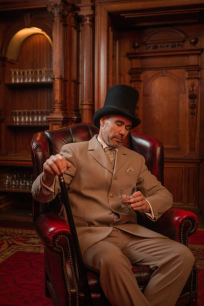 istock A handsome elegant 1920s style gentleman in a luxury brown bar 1447119953