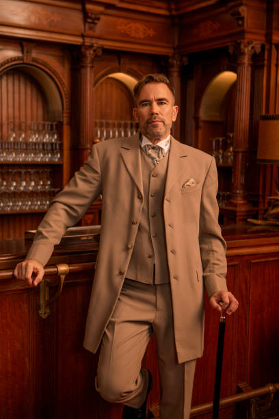 istock A handsome elegant 1920s style gentleman in a luxury brown bar 1447120554