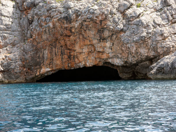istock Blue sea water cave entrance front view 1447120960