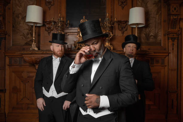 istock Three handsome 1920s style gentlemen in a luxury brown bar 1447121391