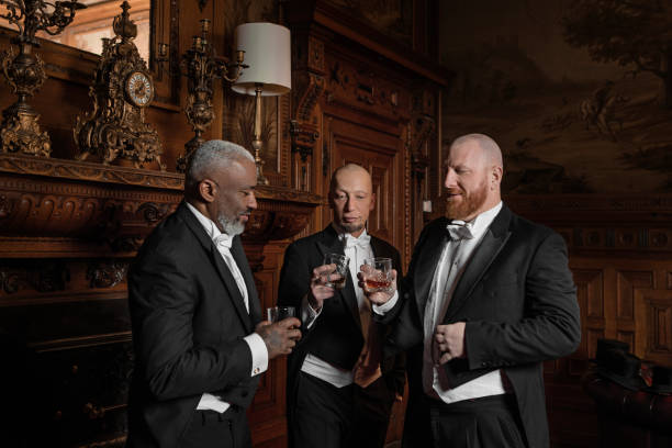 istock Three handsome 1920s style gentlemen in a luxury brown bar 1447121447
