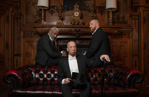 istock Three handsome 1920s style gentlemen in a luxury brown bar 1447121466