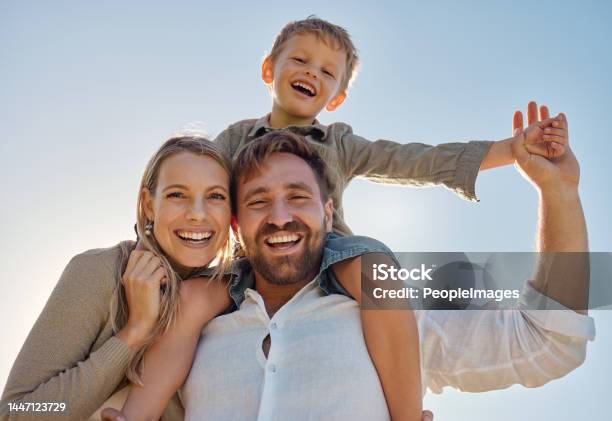 Family Mother And Father With Child For Holiday Vacation And Being Happy Together Outdoor Portrait Mama And Dad With Kid For Quality Time Travel And Bonding Being Loving Carry Boy And Have Fun Stock Photo - Download Image Now