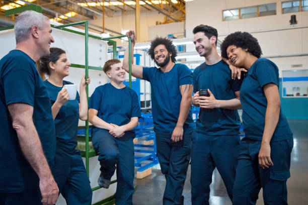 istock Team of workers during coffee break in factory 1447123943
