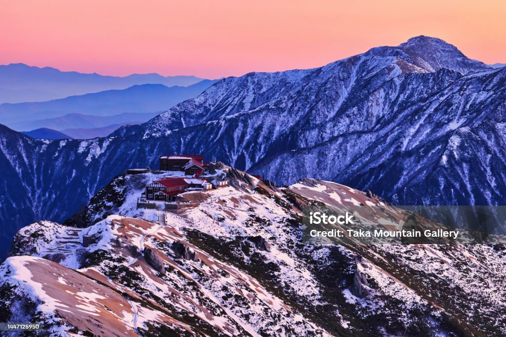 Omote Ginza Traverse Trail from Mt. Tsubakuro to Mt. Yarigatake in the Northern Alps at sunset Backgrounds Stock Photo