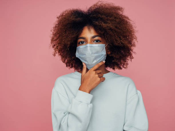 istock Afro girl  in protective mask 1447127275