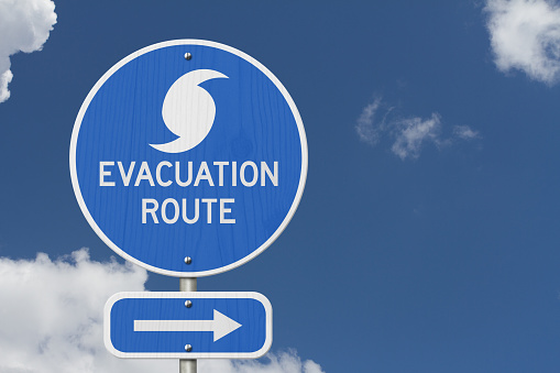 Evacuation Route blue sign road sign with a sky for hurricanes