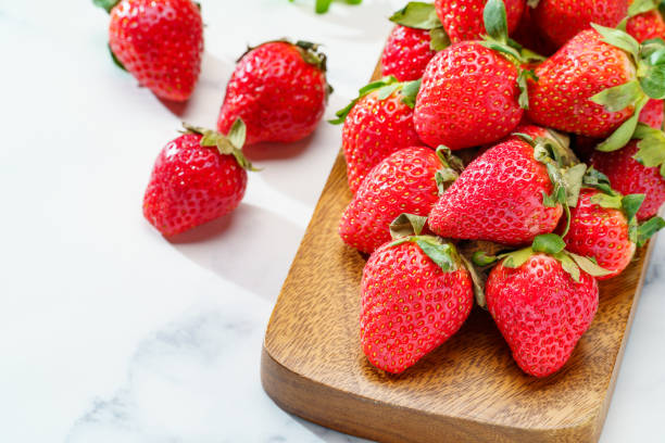 istock Fresh strawberry fruits on marble background 1447128970