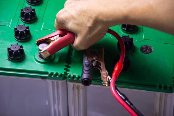 istock Top view, mechanic working with battery tweezers 1447130299