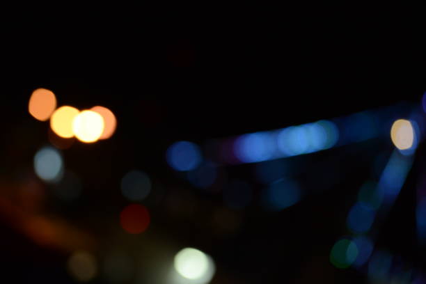 istock Blurry multicolor light from the lamp. blue is the dominant color 1447130411