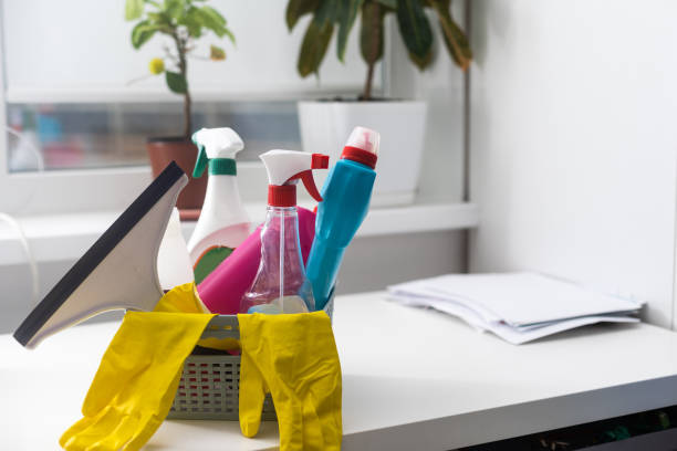 istock Plastic basket with cleaning supplies in home 1447130450