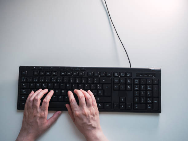 istock Hands of caucasian woman typing in work office 1447130618