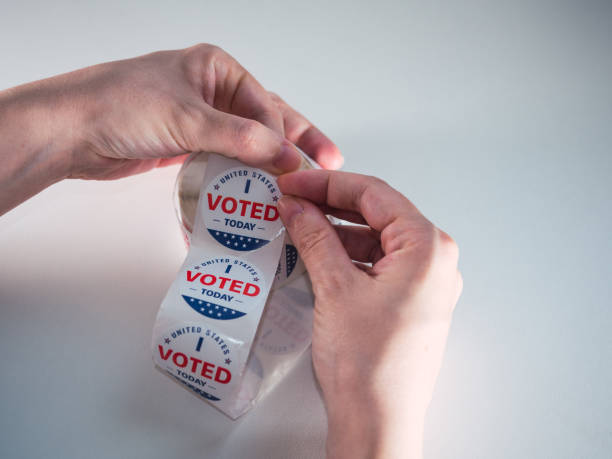 istock Caucasian woman's hands with sticker for US elections 1447130653