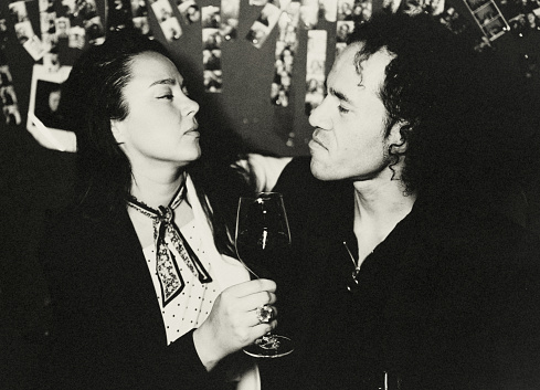 Portrait of a young woman and a young man in a bar in Berlin.