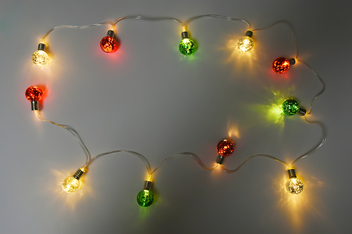 Christmas lights on the dark background with copy space