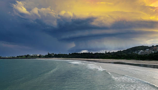 istock Stormy sky dramatic and storm clouds  sky is reflected and highlighted over sea on landscape of this natural coastal scene in Coffs Harbour,  Australia. 1447133313