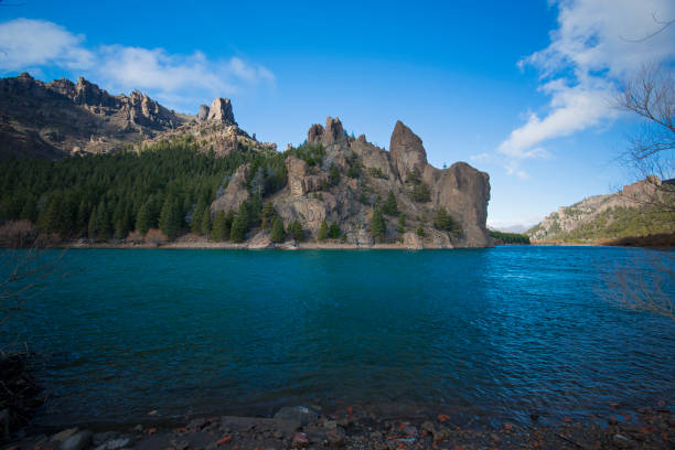 A amazing patagonian blue river between rio negro and neuquen area with scenic mountains at winter, near to Bariloche