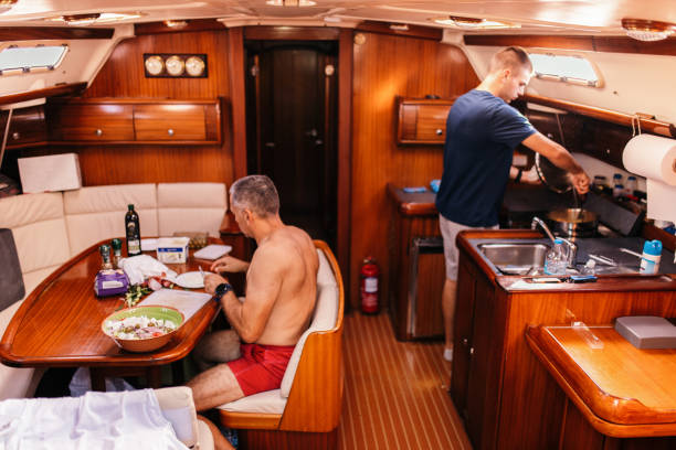 istock Two man preparing food on yacht 1447140695