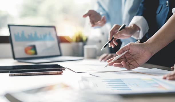 istock Business people meeting at office analyzing graph chart, planning strategy and brainstorming, colleagues thinking concept 1447142044