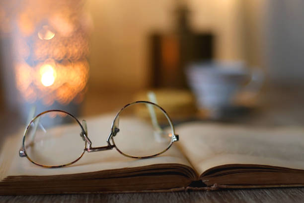 istock Peanut Butter Cookies, Tea, Book, Glasses and Candle 1447144308