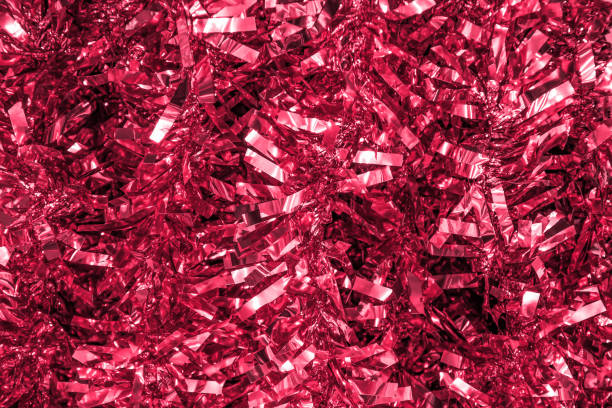 istock Abstract glowing blurred background from red tinsel foil. Glitter lights background. 1447144916