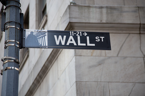Wall Street Sign with Arrow Pointing towards 11 Wall Street where New York Stock Exchange is, Lower Manhattan Financial District, NY, USA. Canon EOS 6D (full Frame Sensor) Camera and Canon EF 24-105mm F/4L IS lens.