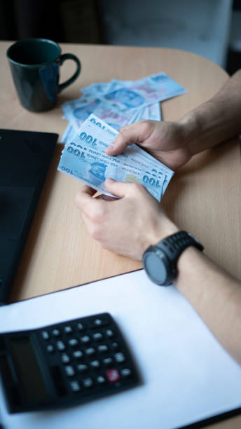 istock Man doing financial calculations at the table 1447150797