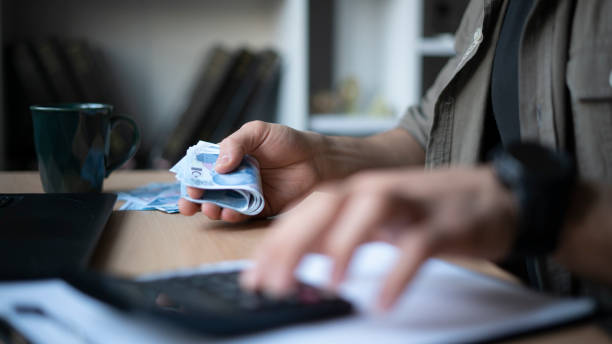 istock Man making personal counting with Turkish money 1447151091