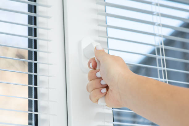 istock Female hand opening the window, close up 1447151861