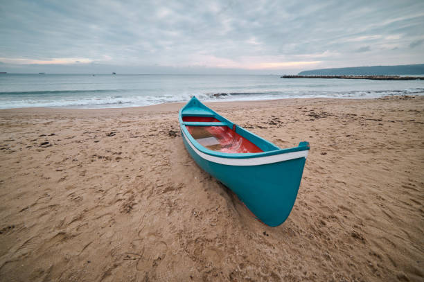 lonely wooden boat on the deserted beach, no people