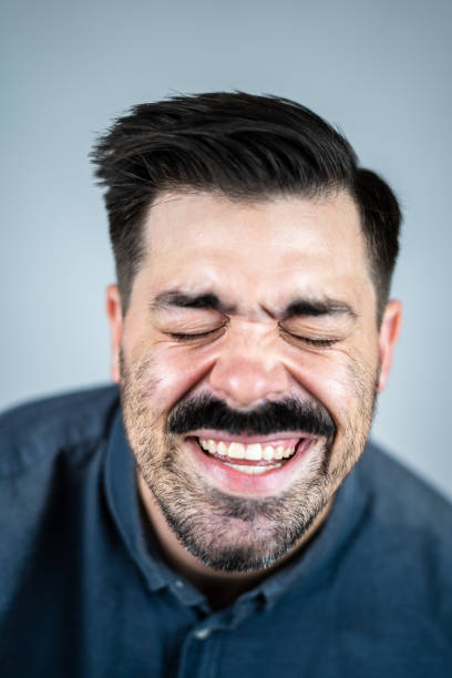 istock Handsome Young Male Studio Headshot on White Background 1447152103