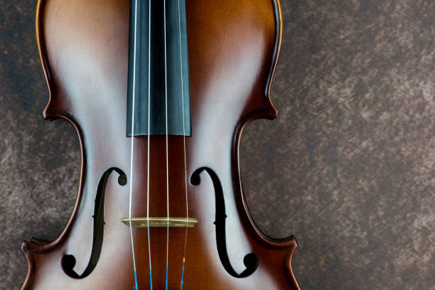 istock Violin Body Closeup on a Mottled Background 1447153548