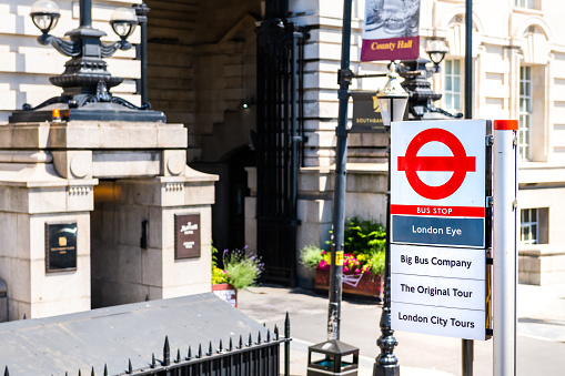 London, United Kingdom - June 22, 2018: High angle view on London Eye underground public bus stop on Westminster bridge road by county hall