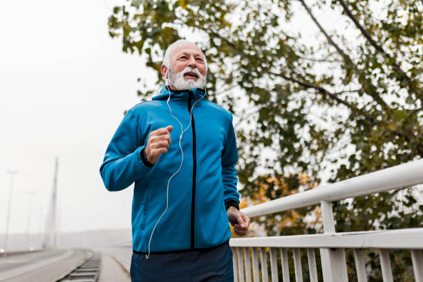 istock Mature man running on a bridge in the morning 1447156779