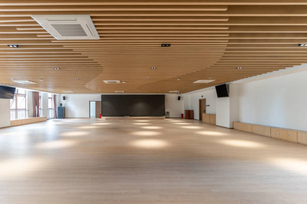 istock Empty and unused spacious hall, wooden ceiling and floor 1447158100