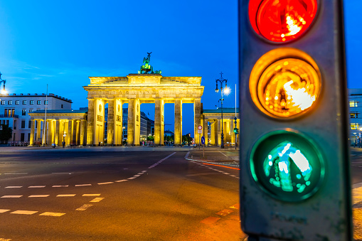 Brandenburger Tor in Berlin with traffic light at sunset