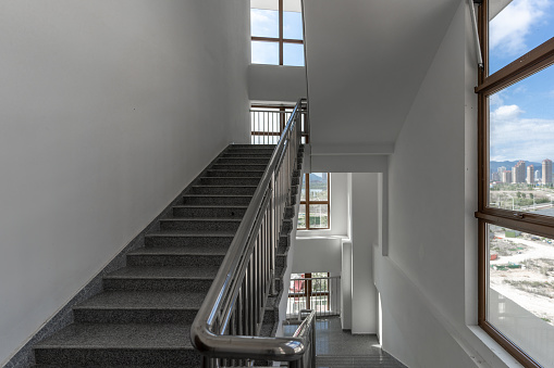 Modern architecture business building, staircase and windows, white walls