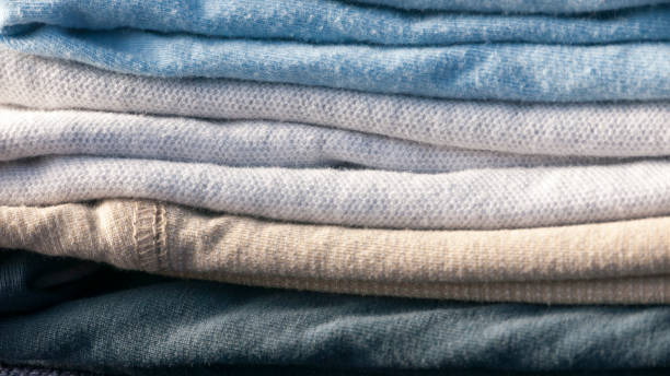 istock Pile of folded cotton shirts 1447158633