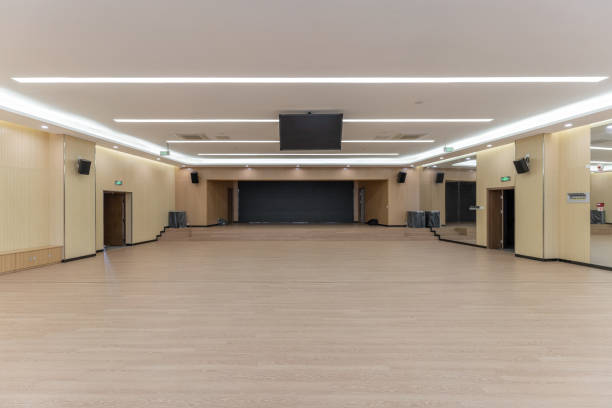 istock An empty unused wooden decorated hall with a large electronic screen 1447158816