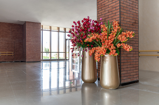 Two ornamental flowerpots in the corridor of the reception hall