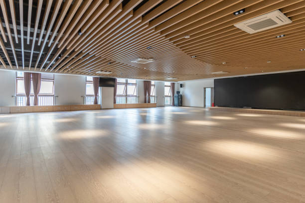 istock An empty spacious classroom with wooden floor and ceiling 1447159593