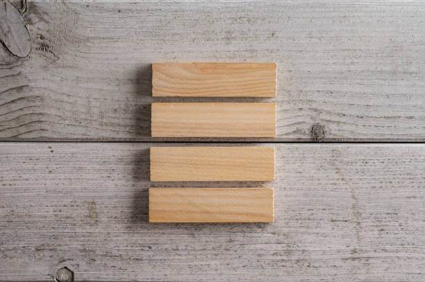 istock Stack of four blank wooden pegs or blocks 1447160357