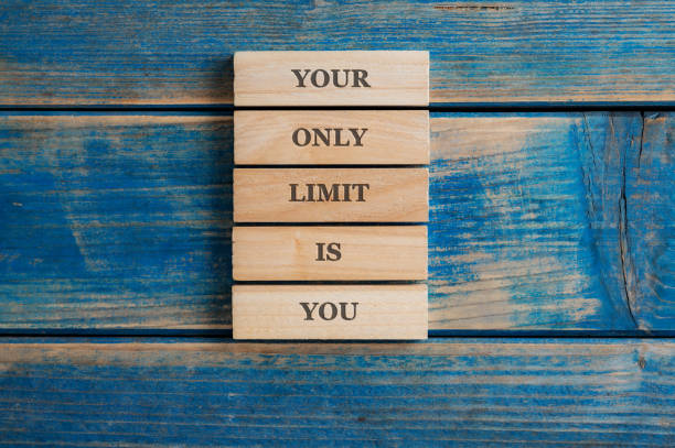 Your only limit is you sign written on a stack of five wooden pegs stock photo