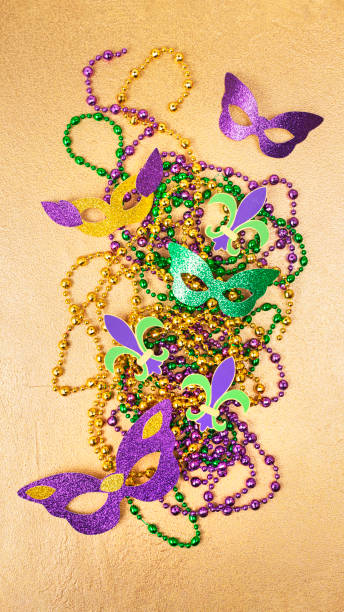 istock Multi color Mardi Gras background with beads and envelop. Top view 1447162768