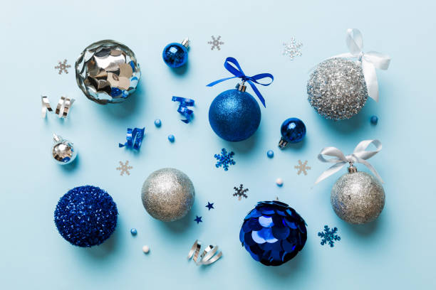 istock Christmas ball on colored background. decoration bauble with ribbon bow with copy space 1447163481