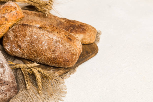 istock Homemade natural breads. Different kinds of fresh bread as background, perspective view with copy space 1447166411